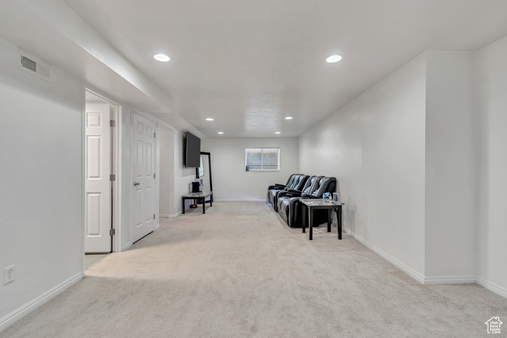 Living area featuring carpet flooring and recessed lighting