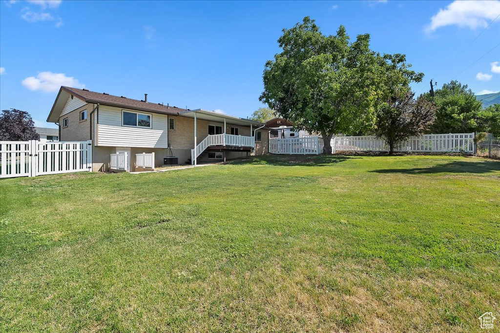 Fenced backyard with stairs