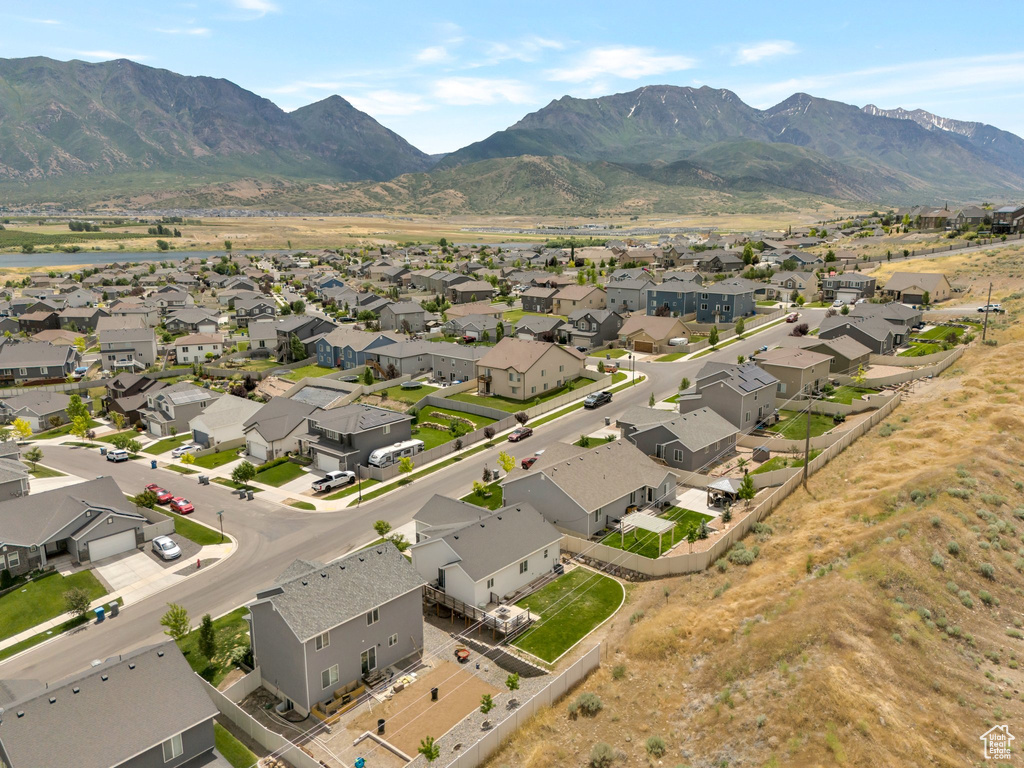 Aerial perspective of suburban area with a mountainous background