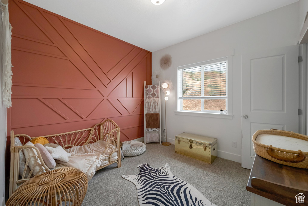 Bedroom with carpet floors and baseboards