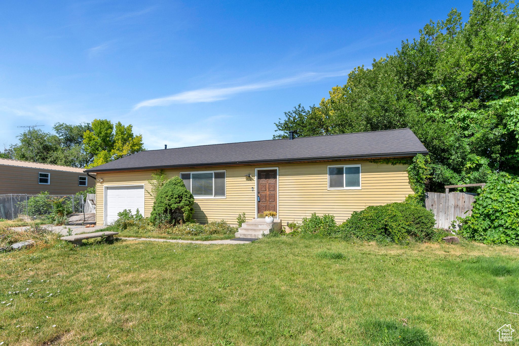 Ranch-style home featuring an attached garage