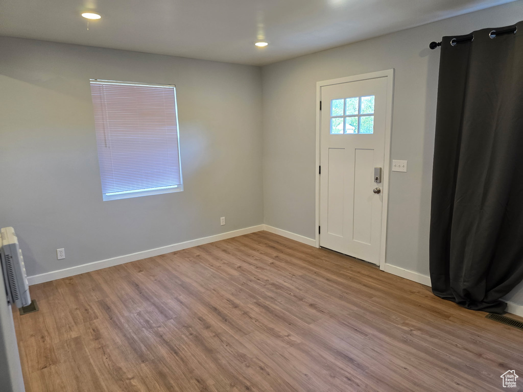 Foyer entrance featuring wood finished floors and recessed lighting