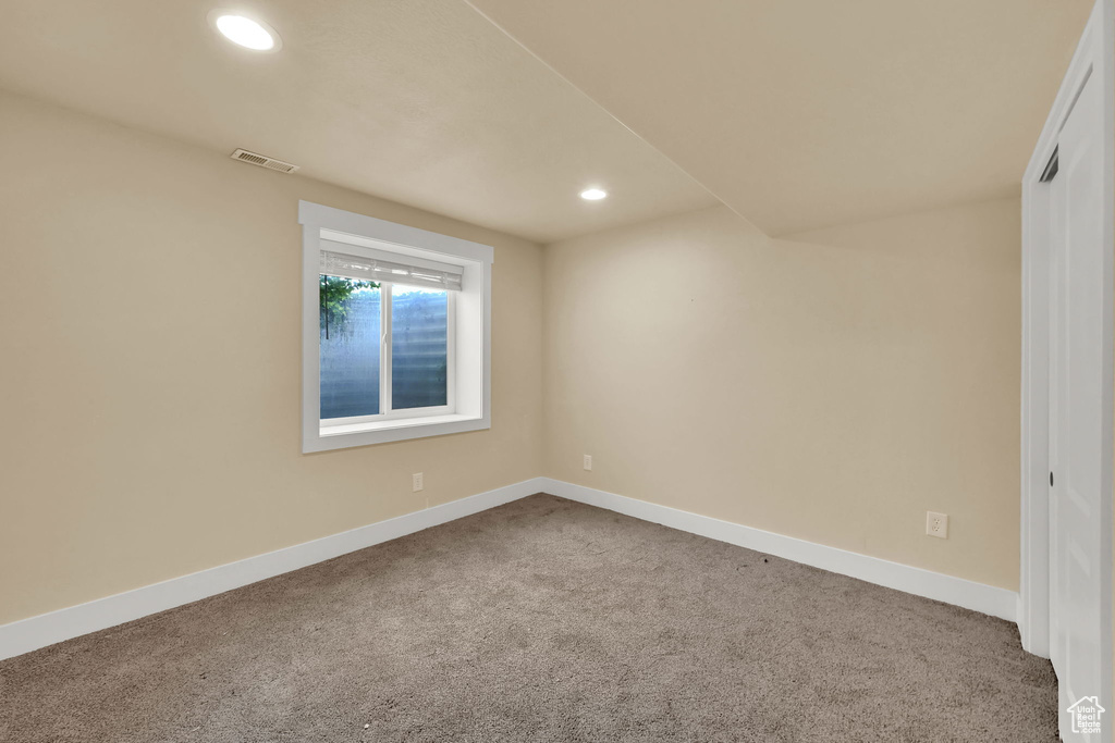 Spare room with carpet and recessed lighting