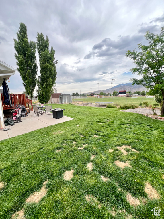 View of yard featuring a patio and a mountain view