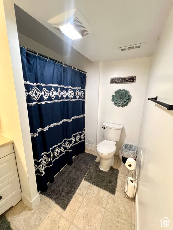 Full bath featuring vanity and curtained shower