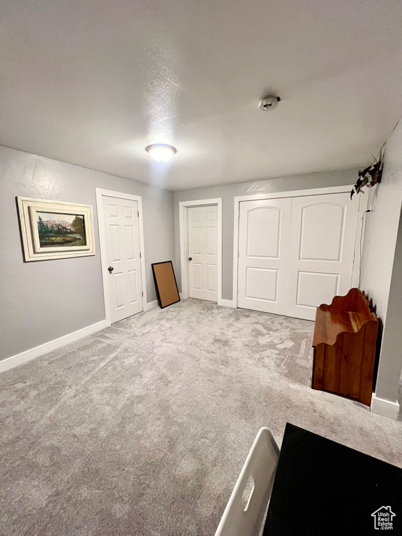 Basement with carpet flooring and baseboards