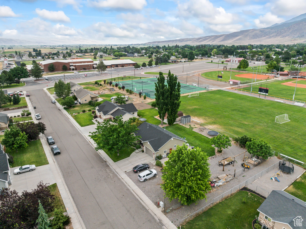 Aerial perspective of suburban area with a mountain backdrop