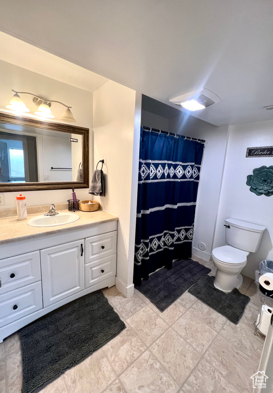 Bathroom with vanity and toilet