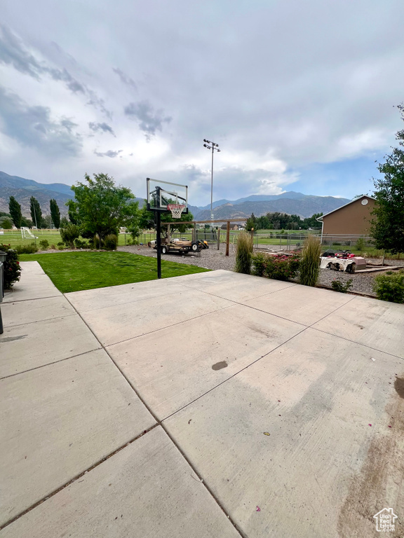 View of patio / terrace with a mountain view and basketball court