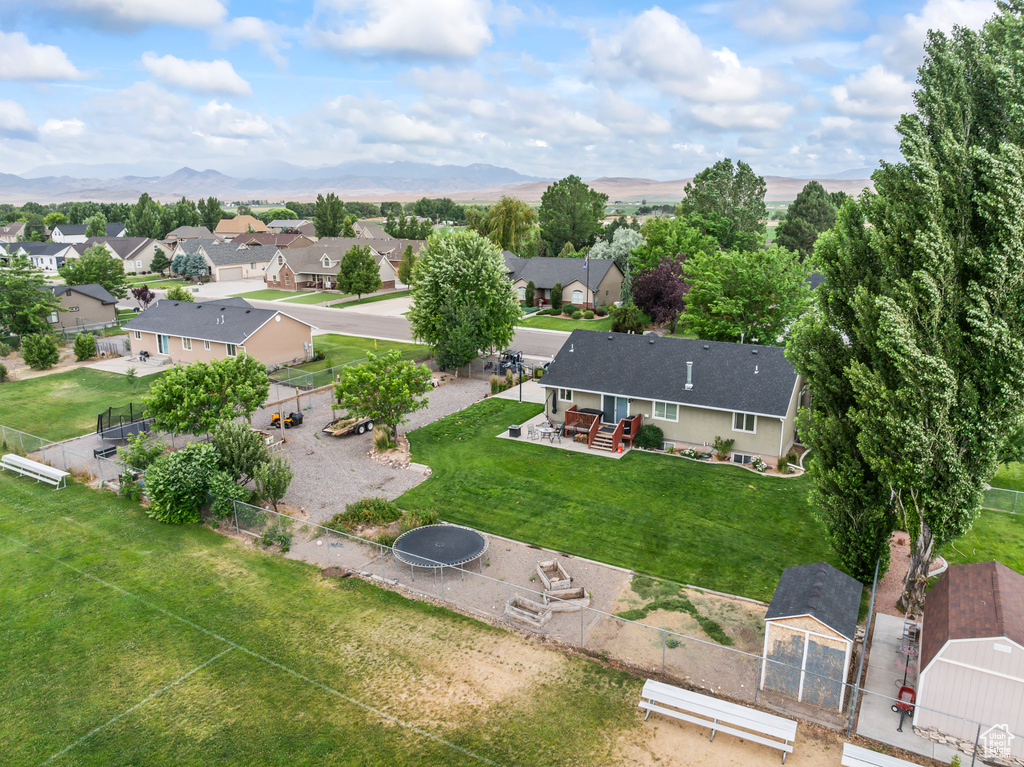 Aerial perspective of suburban area featuring a mountain backdrop