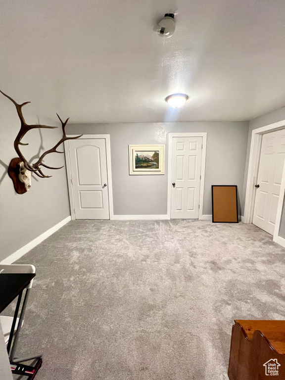 Basement featuring carpet flooring
