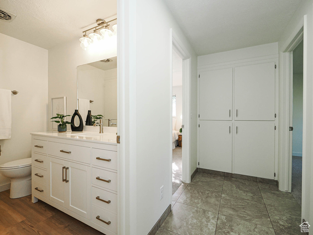 Bathroom with vanity and ensuite bath