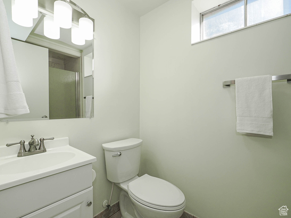 Full bath with vanity and a shower