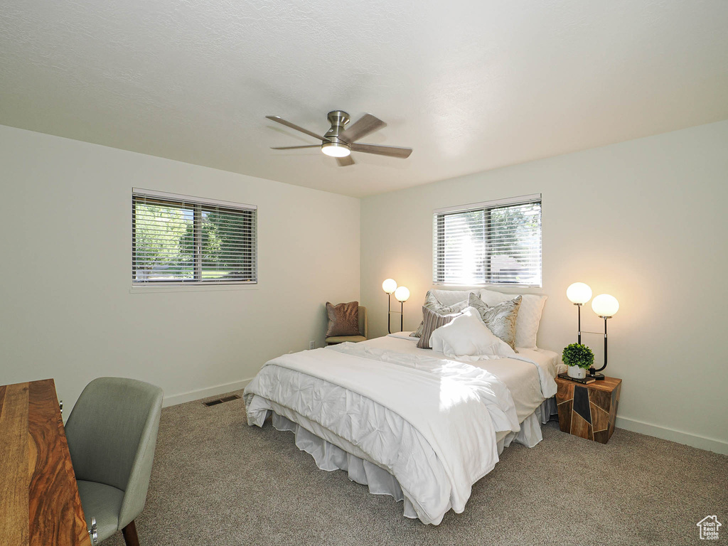 Bedroom featuring carpet flooring and a ceiling fan