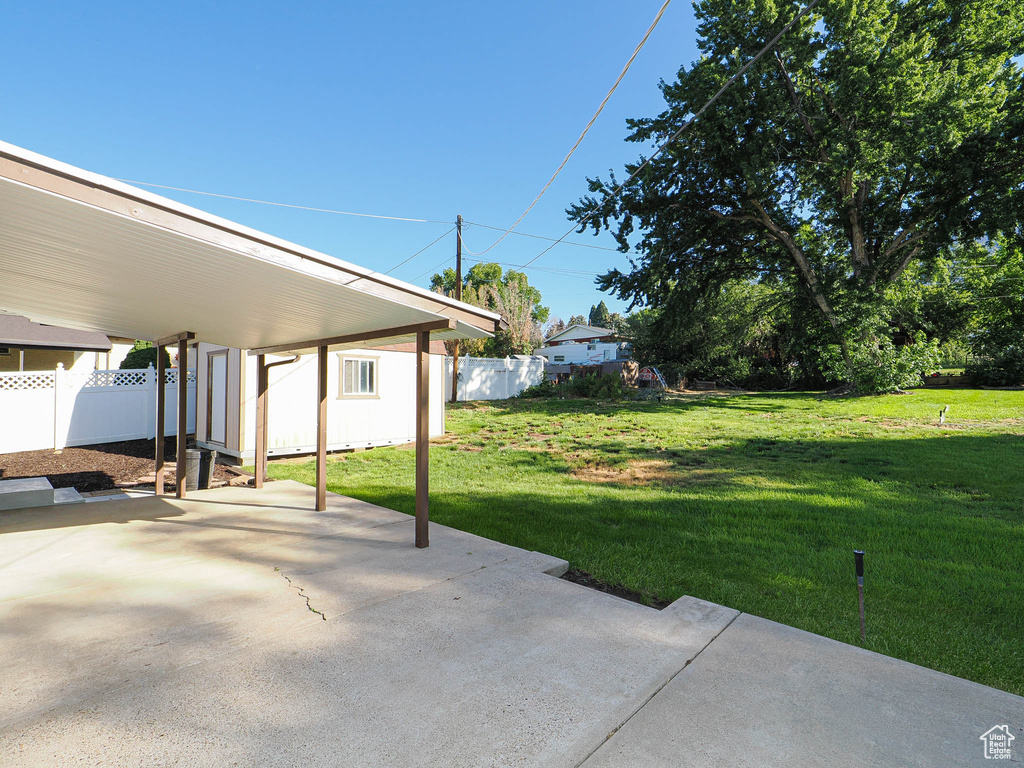 View of patio / terrace with a carport