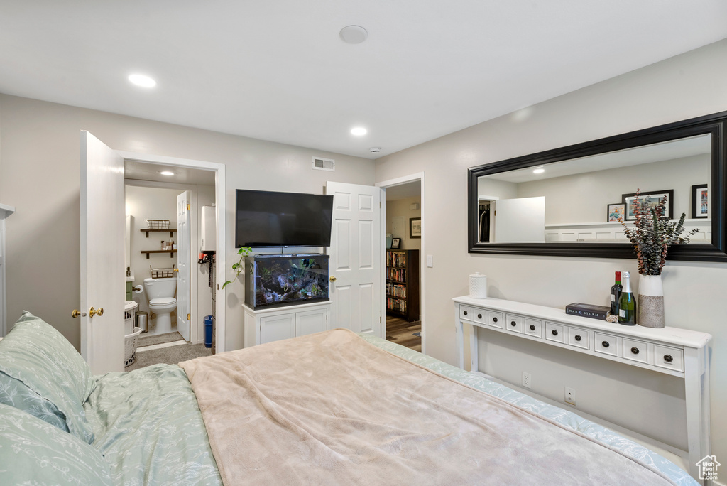 Bedroom with recessed lighting and connected bathroom