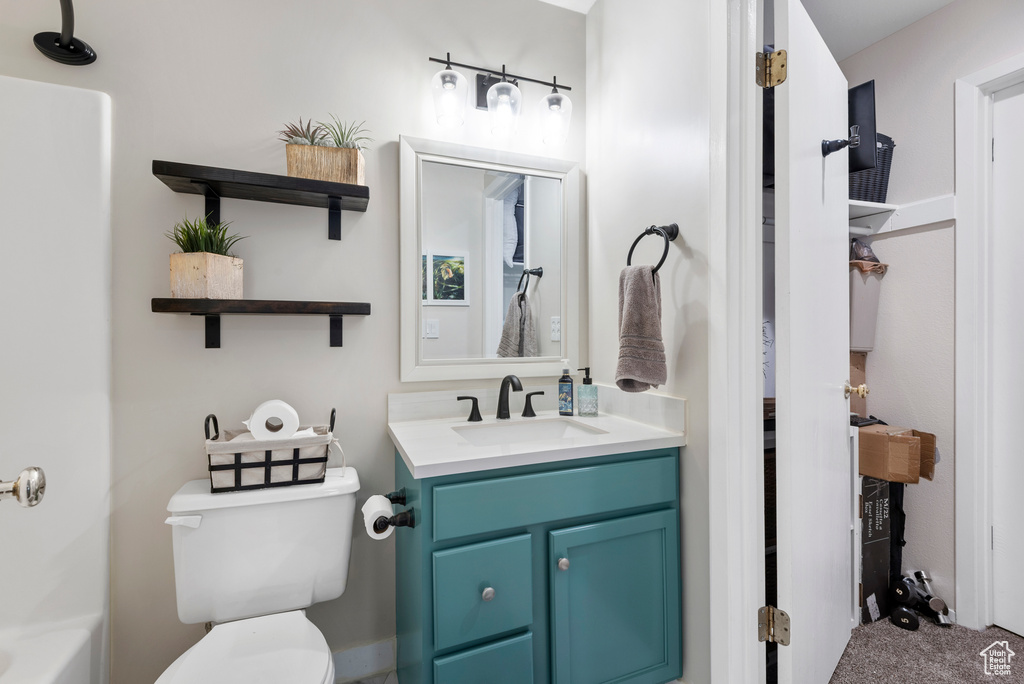 Full bathroom with vanity and toilet
