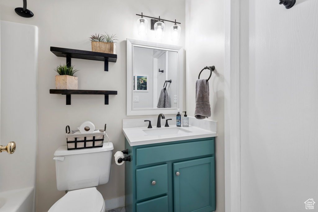 Full bath with vanity and a bathtub