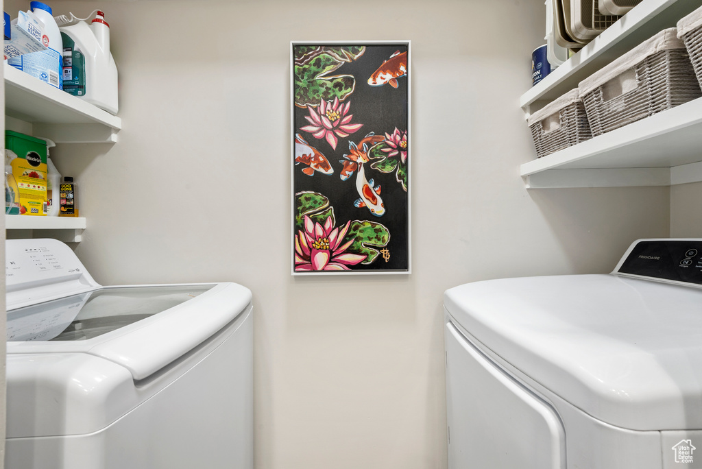Laundry area with washing machine and clothes dryer