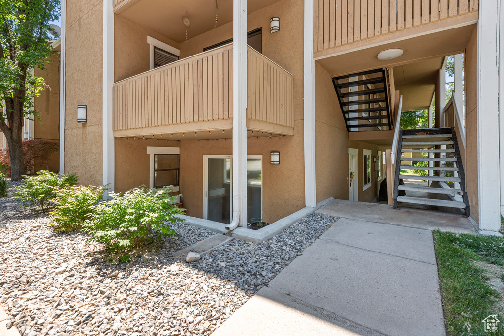 Property entrance featuring stucco siding