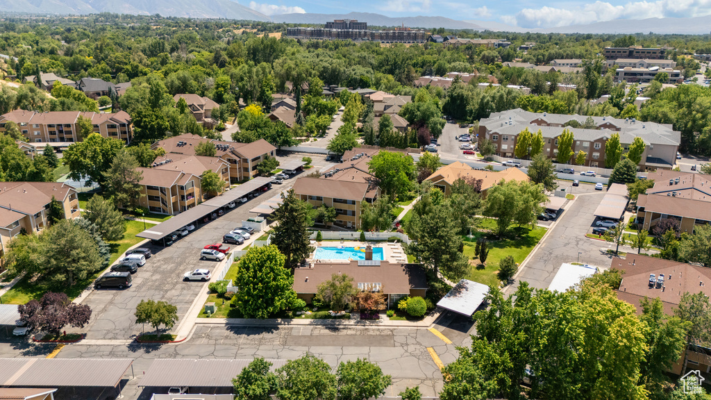 Aerial perspective of suburban area with mountains and a pool area