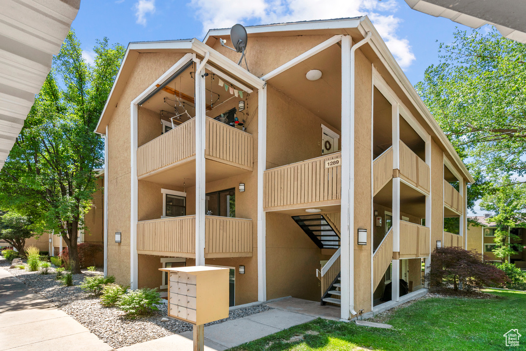 View of apartment building / complex with stairs