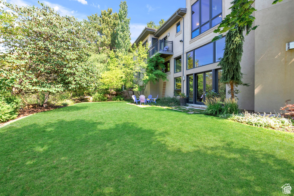 View of green lawn with a balcony