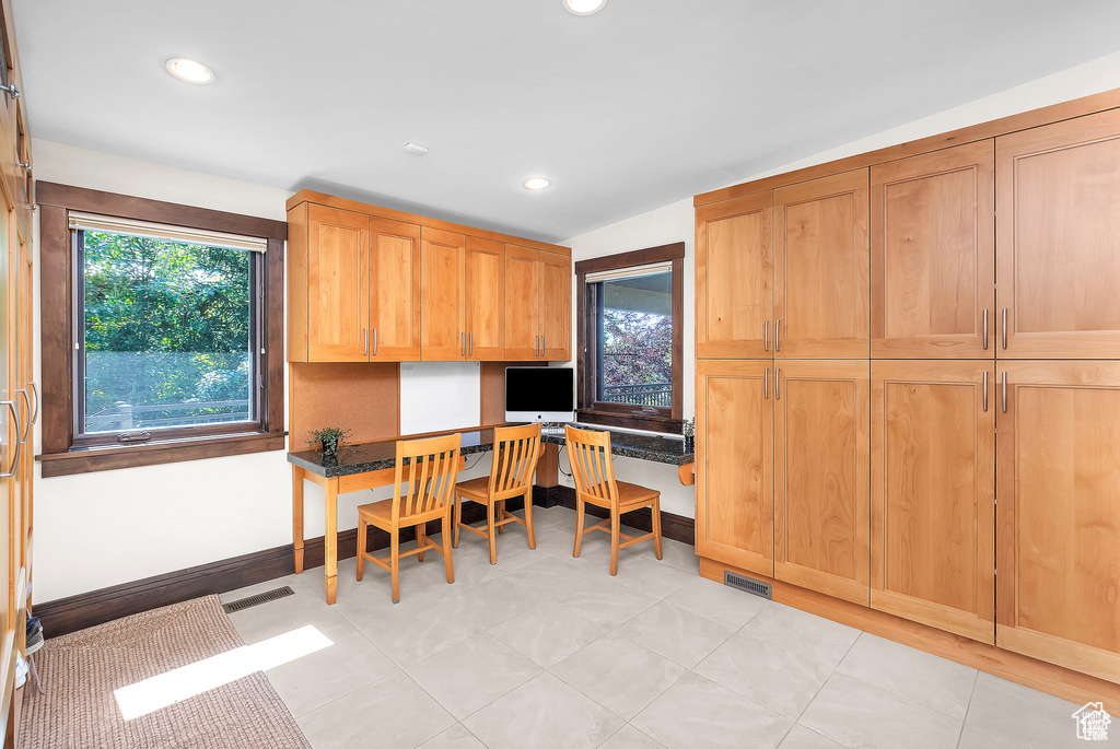 Office with built in study area and recessed lighting