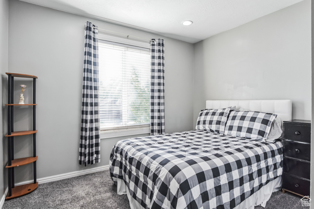 Bedroom with carpet floors, multiple windows, and recessed lighting