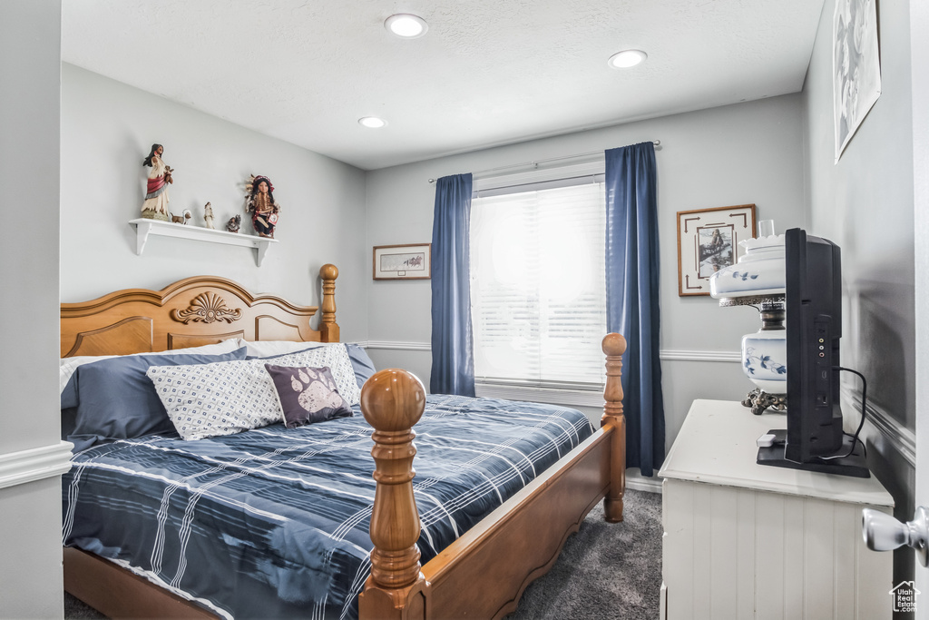 Carpeted bedroom featuring baseboards and recessed lighting