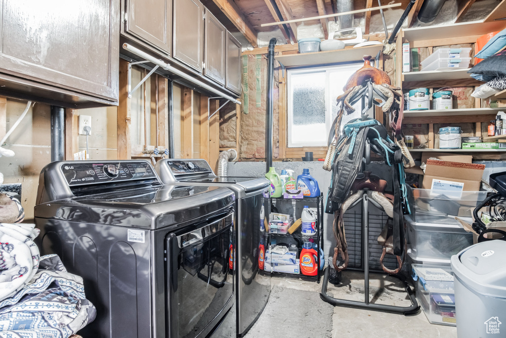 Laundry room with washing machine and dryer and cabinet space