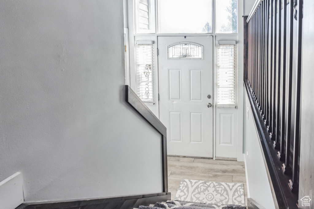 Entrance foyer with wood finished floors