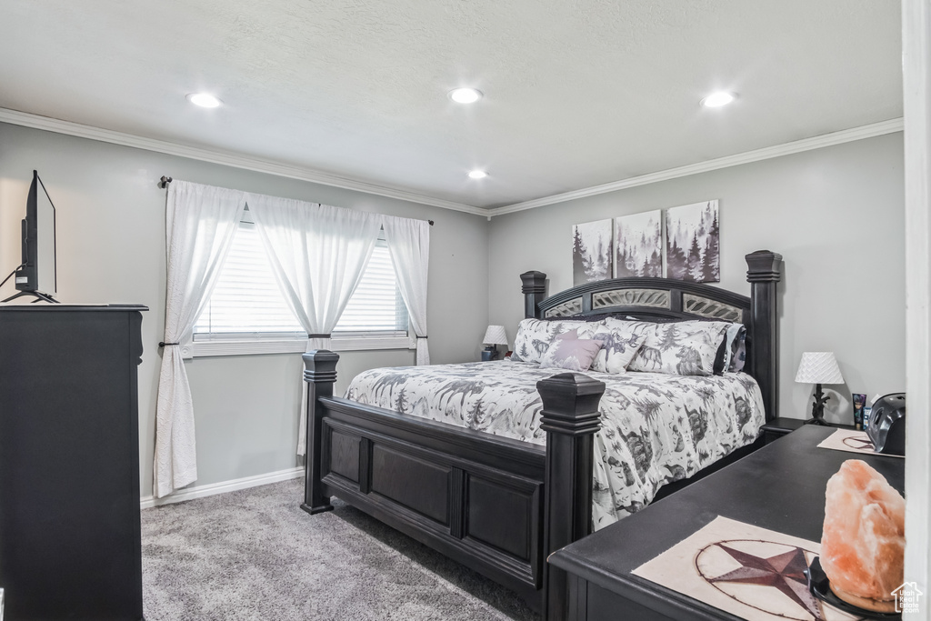 Bedroom with carpet floors, recessed lighting, and crown molding