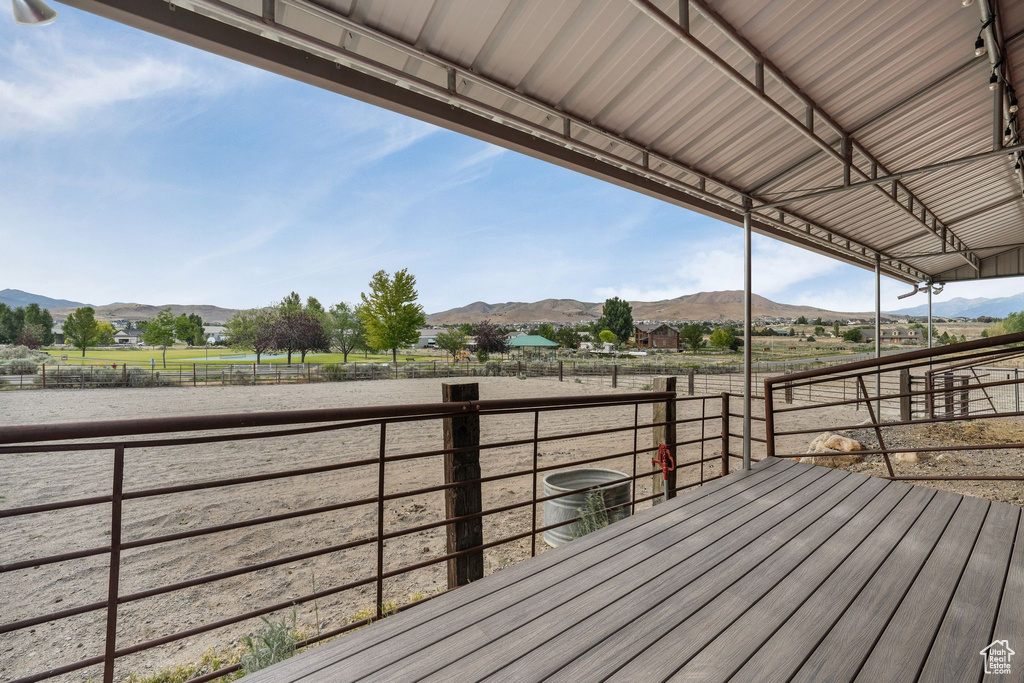 Wooden terrace with a mountain view and a view of countryside