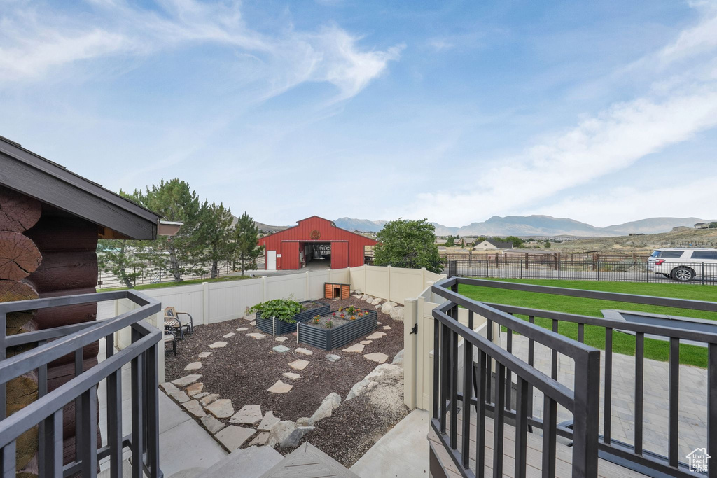 View of patio / terrace with a garden and a mountain view