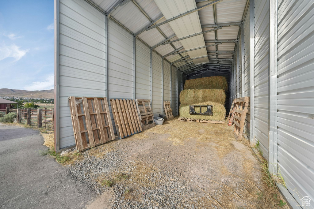 Garage featuring a carport and a mountain view