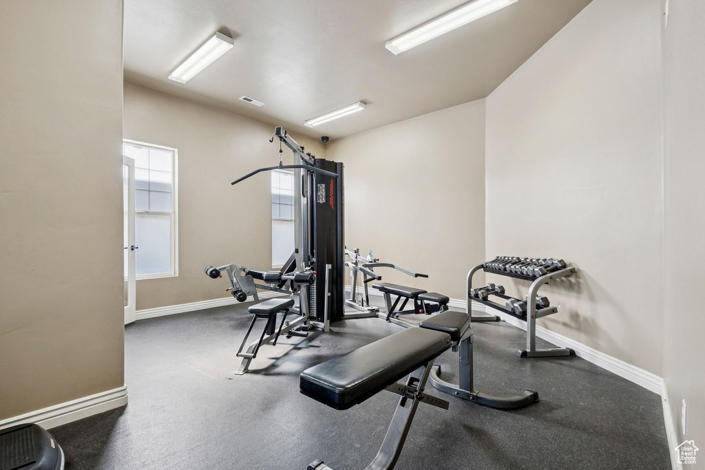 Workout area featuring baseboards