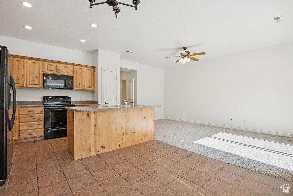 Kitchen featuring black appliances, open floor plan, recessed lighting, ceiling fan, and carpet flooring