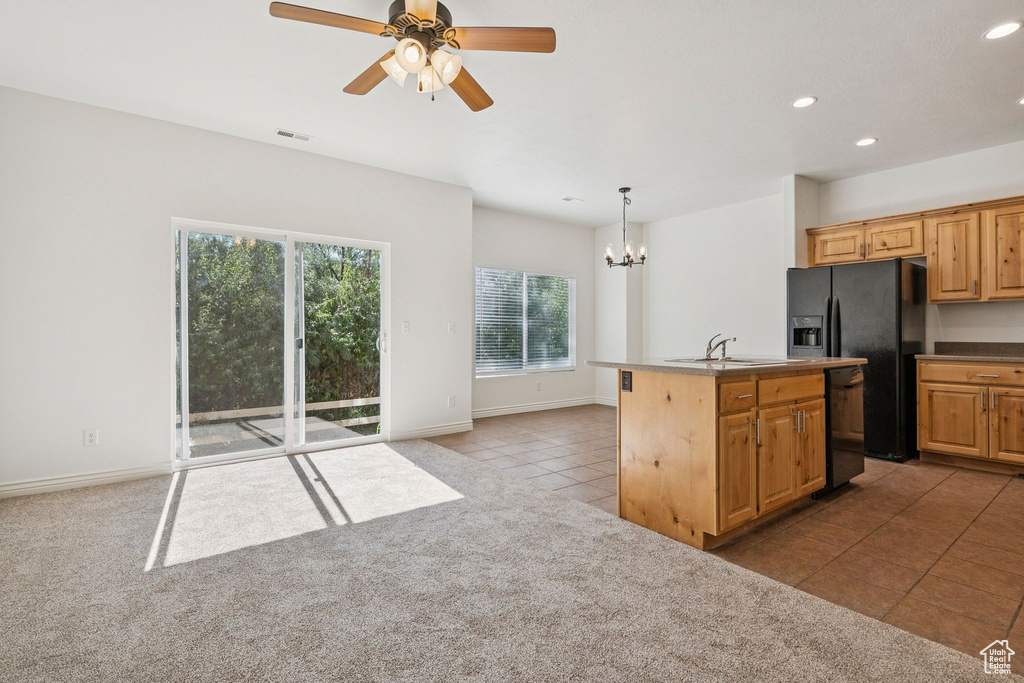 Kitchen with black appliances, a chandelier, light tile patterned flooring, recessed lighting, and ceiling fan