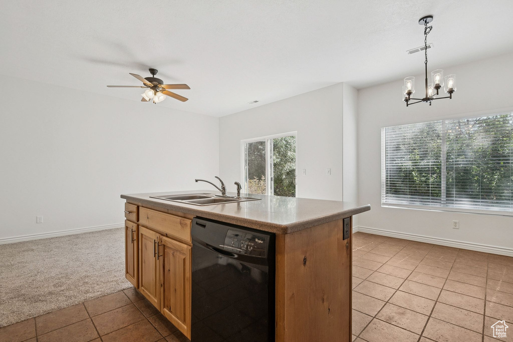 Kitchen featuring dishwasher, light tile patterned floors, light colored carpet, ceiling fan, and a chandelier