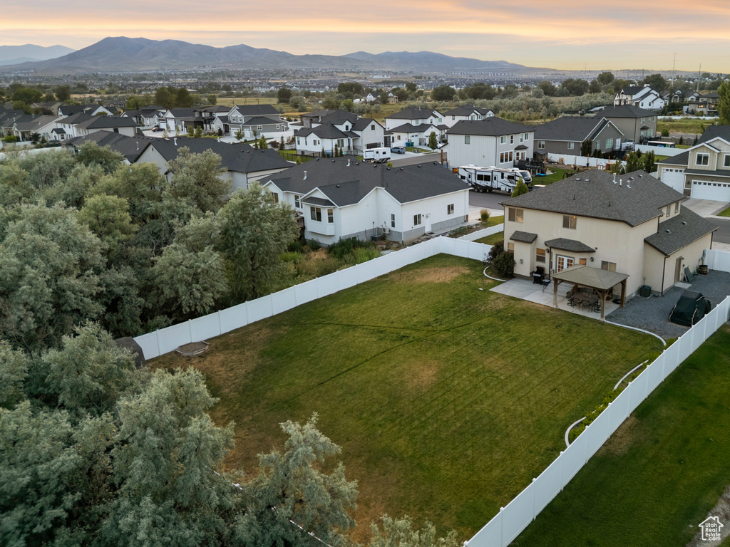 Aerial view at dusk of a residential view and a mountain view