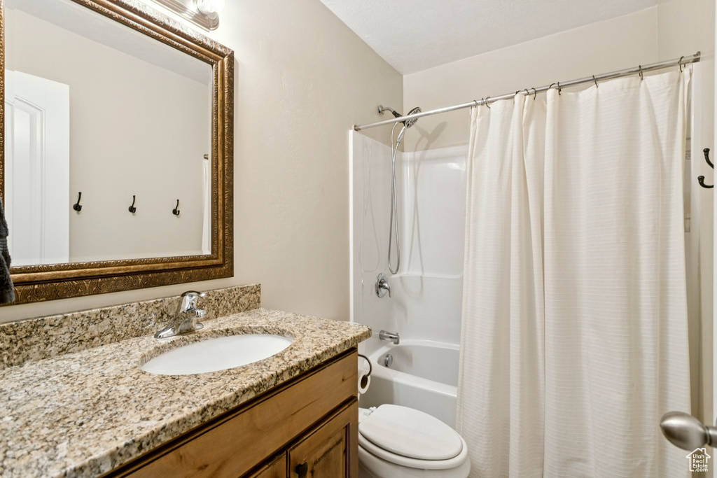Full bathroom with vanity and shower / bathtub combination with curtain