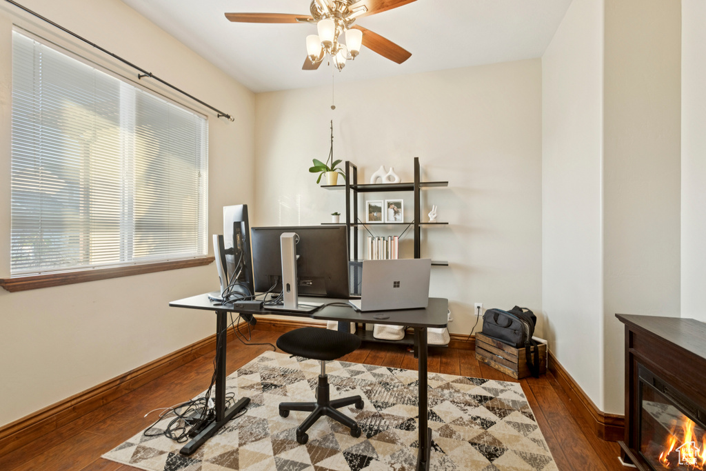 Home office with ceiling fan and wood finished floors