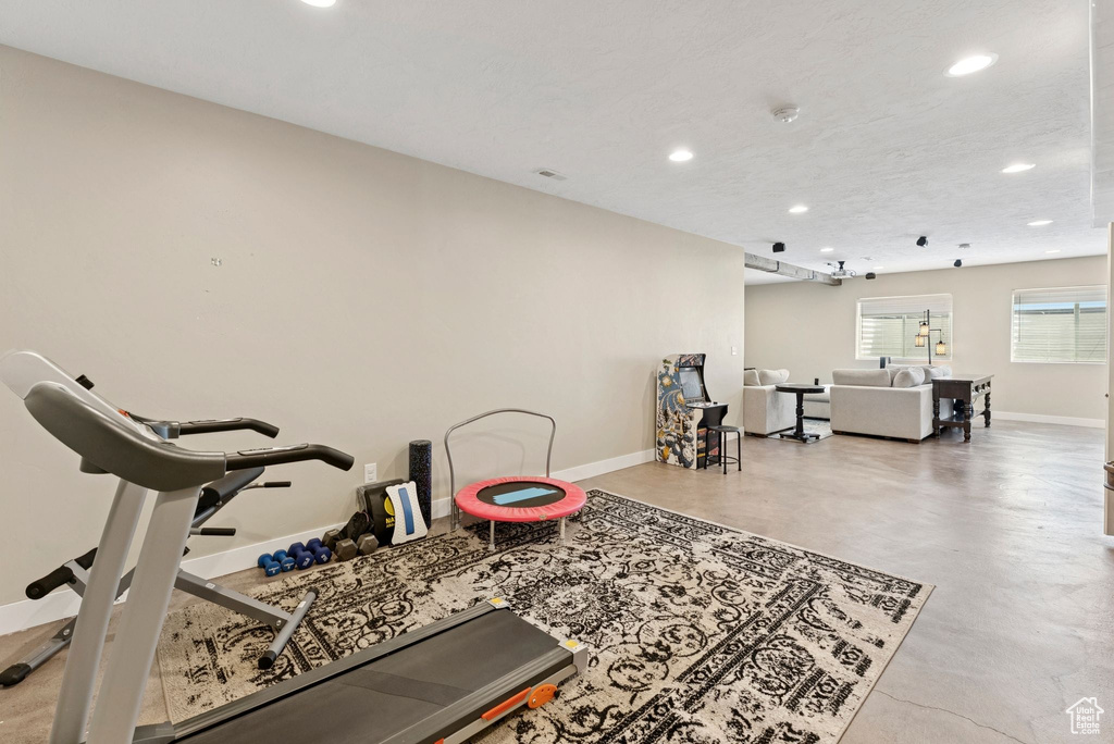 Workout area featuring recessed lighting