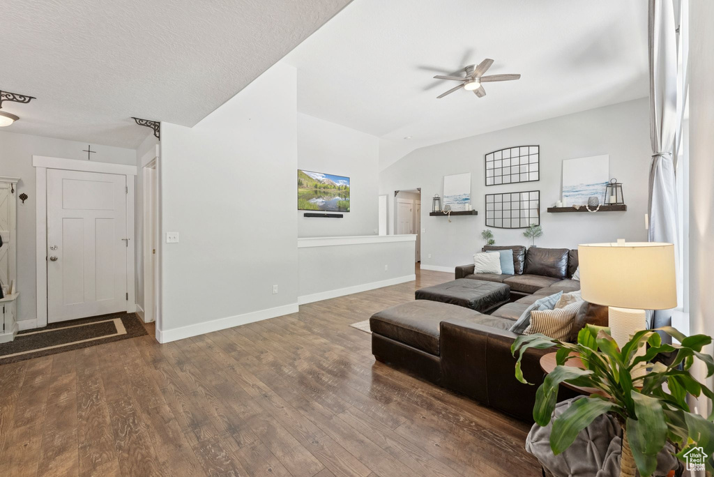 Living room with a ceiling fan and wood finished floors