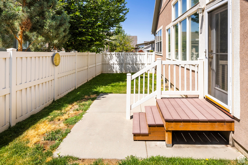Fenced backyard with a patio area