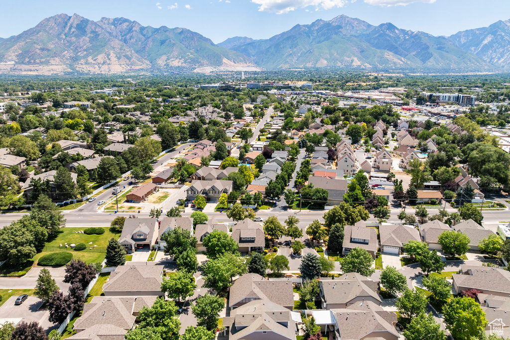 Aerial view of residential area featuring a mountain backdrop