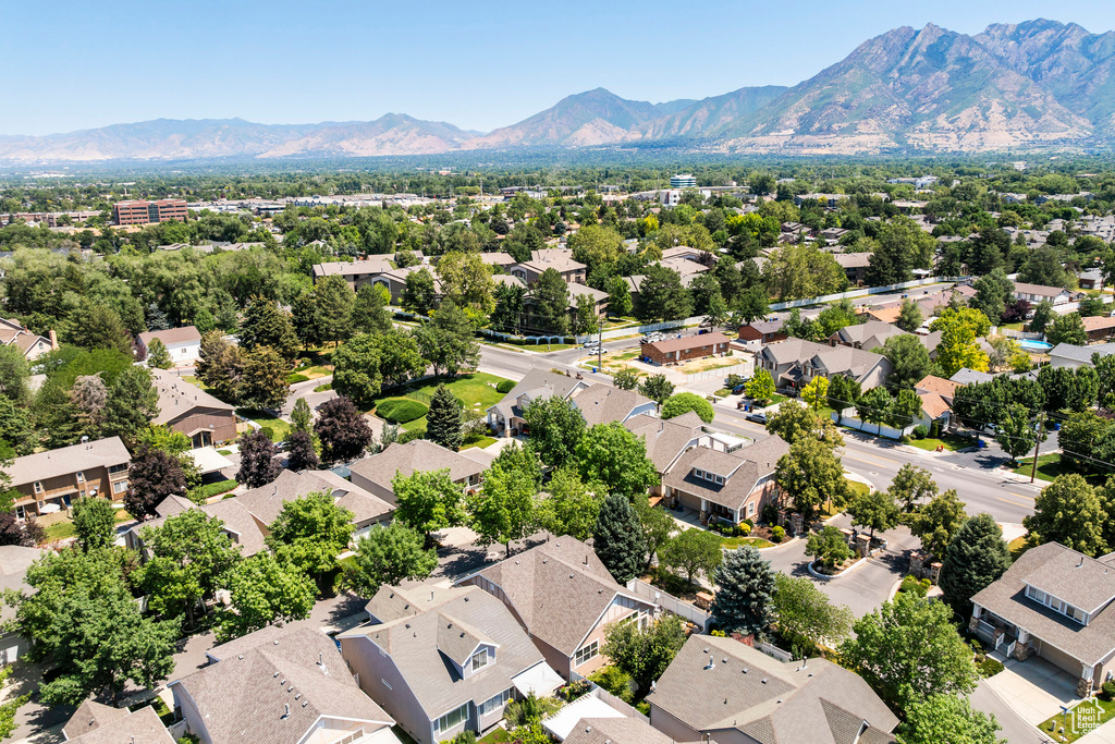 Aerial perspective of suburban area with a mountainous background