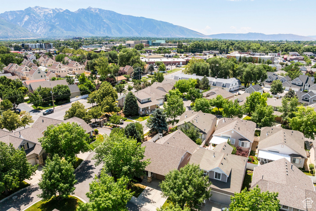 Aerial perspective of suburban area featuring a mountain backdrop