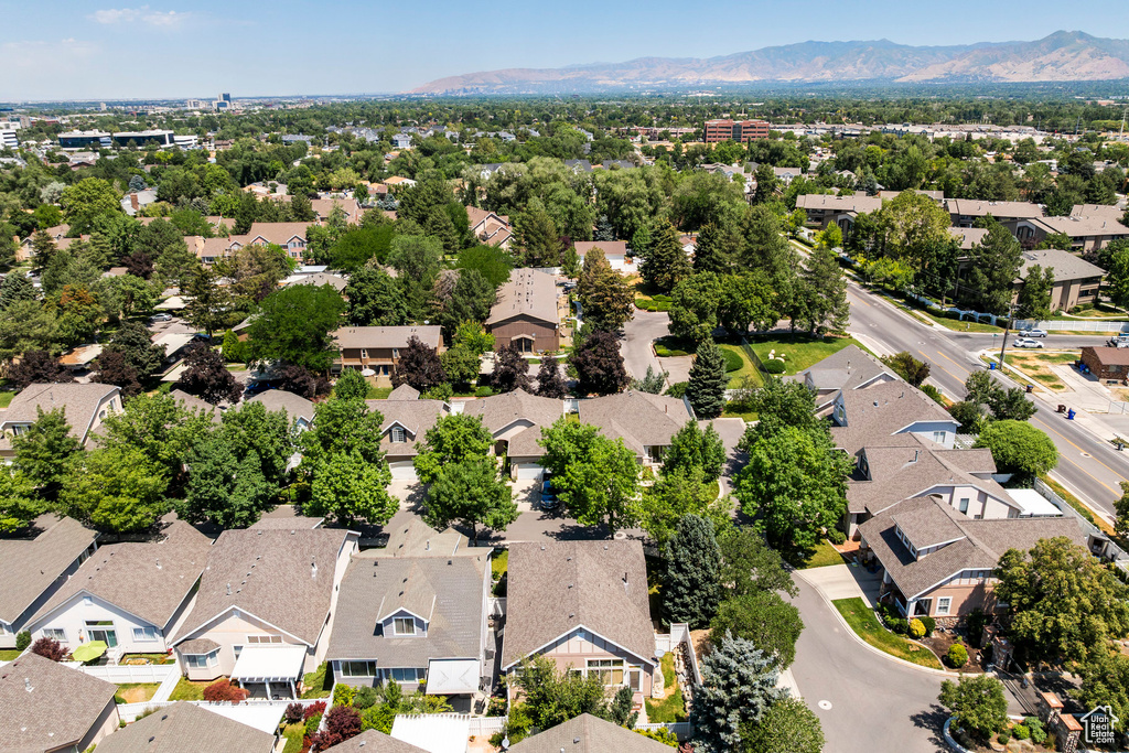 Aerial perspective of suburban area with a mountain backdrop